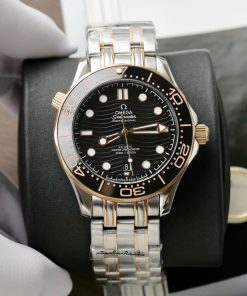 Đồng hồ Omega Seamaster Fake 11 Thuỵ Sỹ demi vàng hồng mặt đen 42mm (2)
